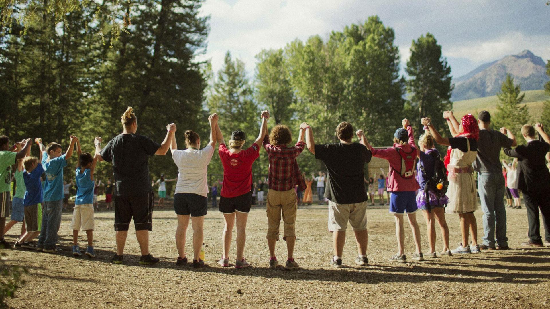 kids holding hands in a circle